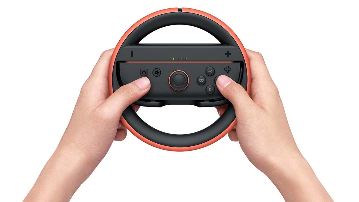 Nintendo joy-con 2 rdeč volan v uporabi za dirkalne igre na nintendo switch 2