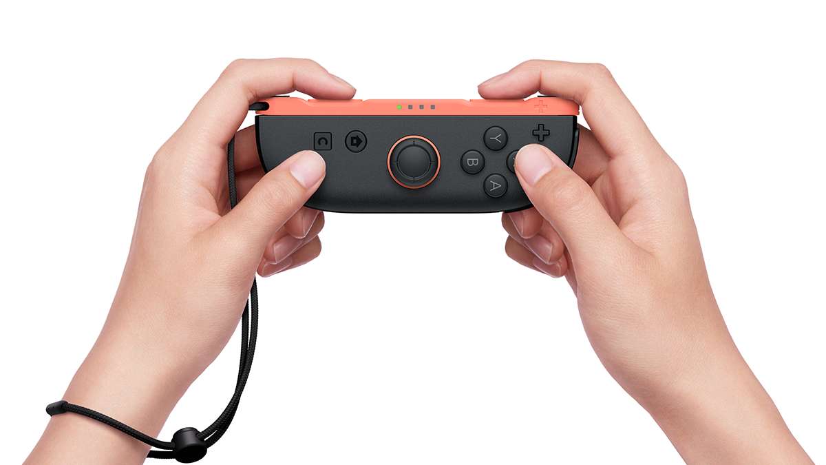 Nintendo joy-con 2 r light red uporaba s paščkom v rokah