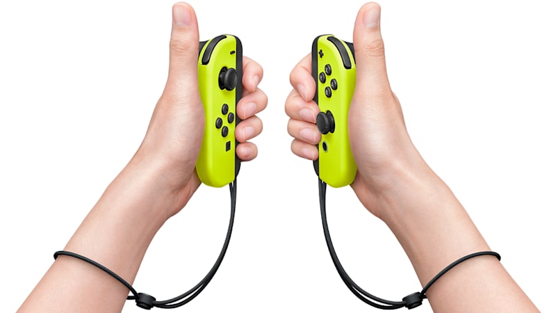 Nintendo Switch : des Joy-Con jaunes néon et une batterie à piles