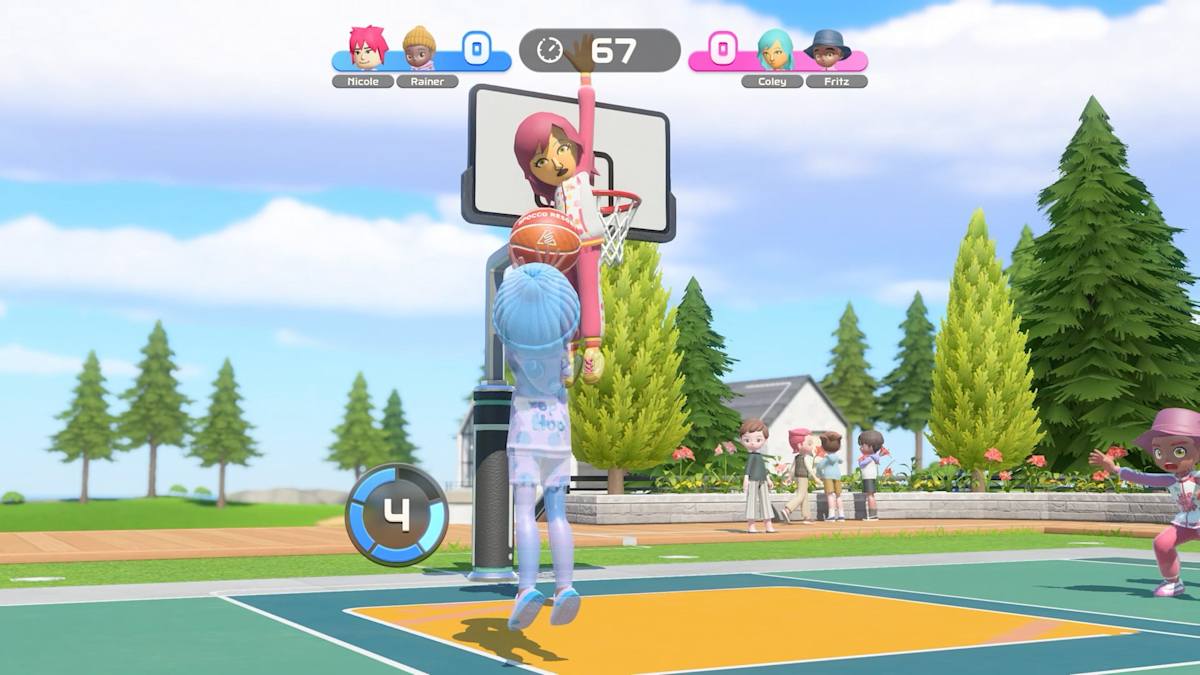 A Mii goes up for a dunk in a two-on-two basketball game, with pine trees and spectators behind the court