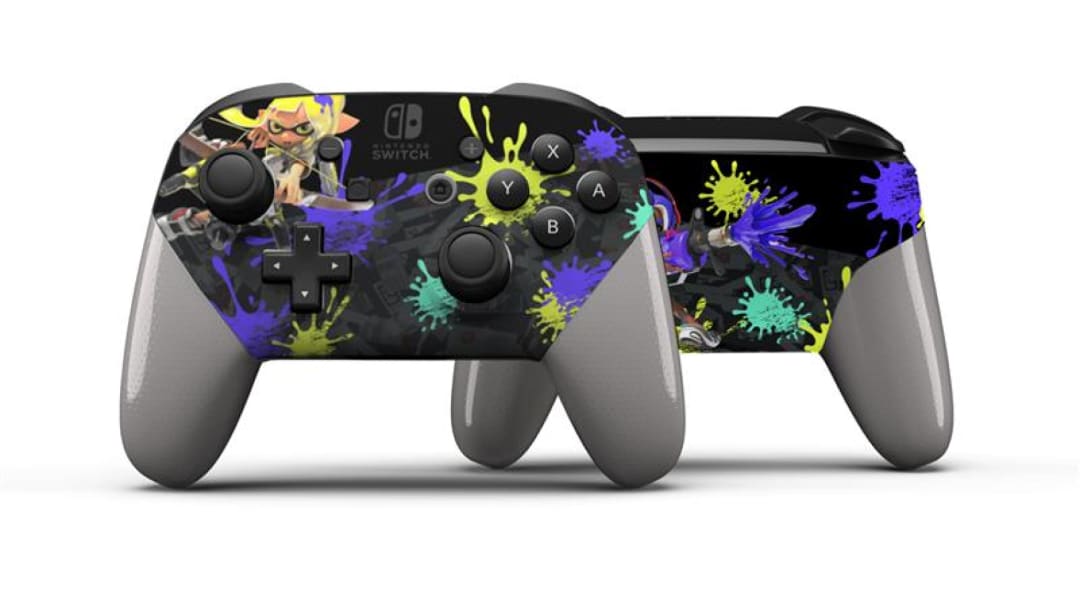 This custom-painted controller features Inklings and splat patterns on the front and back. The handles of the controller are a metallic grey.
