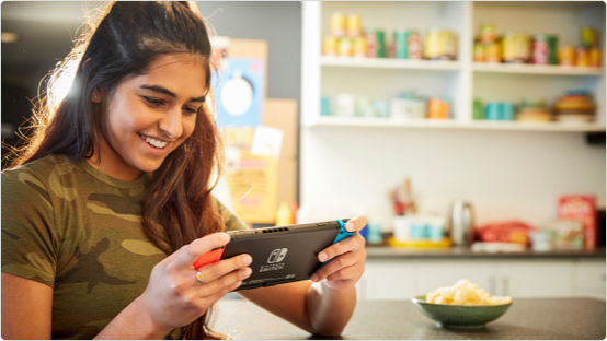 Woman playing on her Nintendo Switch