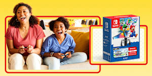 Mom and child gaming, featuring the Nintendo Switch™ - OLED Model + Super Mario Bros.™ Wonder Bundle