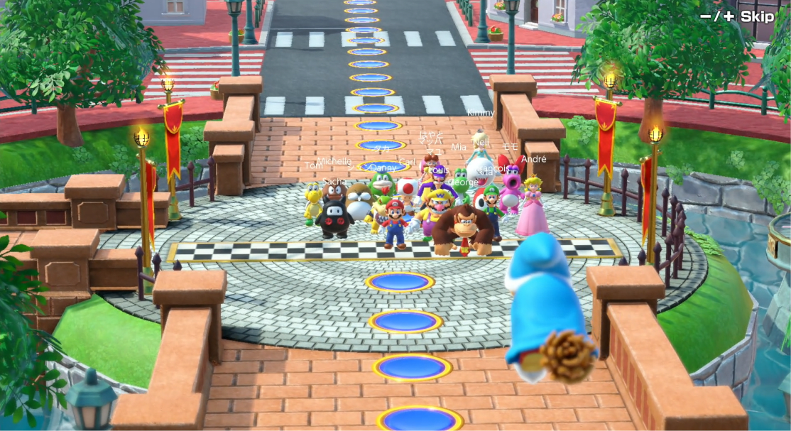 20 players stand before Kamek at the starting line of the Koopathlon.