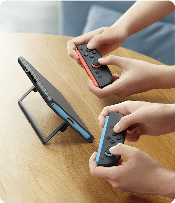 Switch 2 Red and Blue Joy-Con- גבר משחק בקונסולה