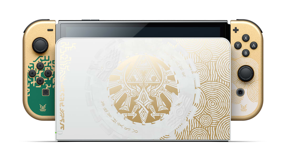 Glossy white Nintendo Switch dock with gold Hylian illustrations