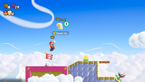 Mario jumps up to revive another player in multiplayer mode.